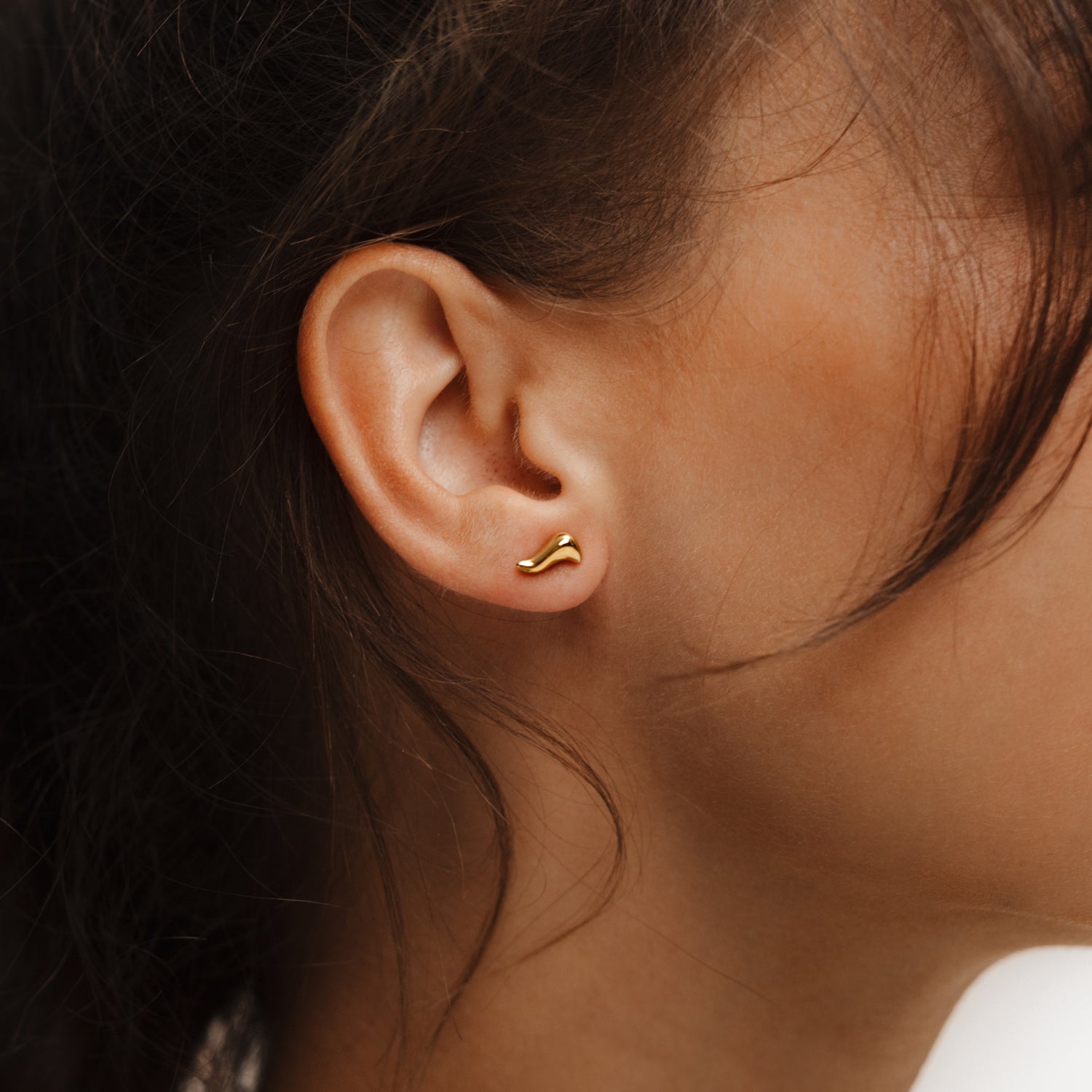 Poise Flow Stud Earrings, recycled 18k Gold Vermeil, shown on ear - VEYIA Berlin