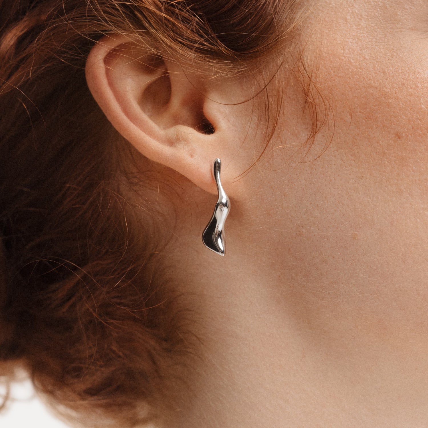 Poise Molten Drop Earrings, recycled Sterling Silver, shown on ear - VEYIA Berlin