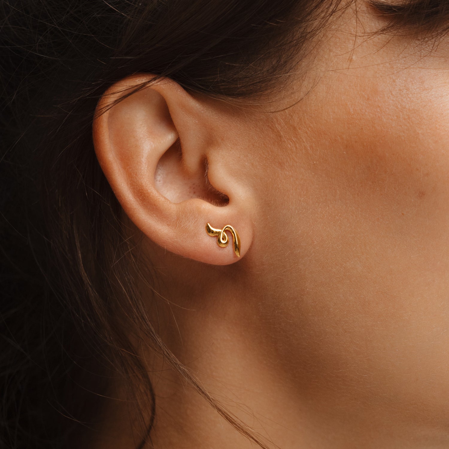 Poise Twirl Stud Earrings, recycled 18k Gold Vermeil, shown on ear - VEYIA Berlin