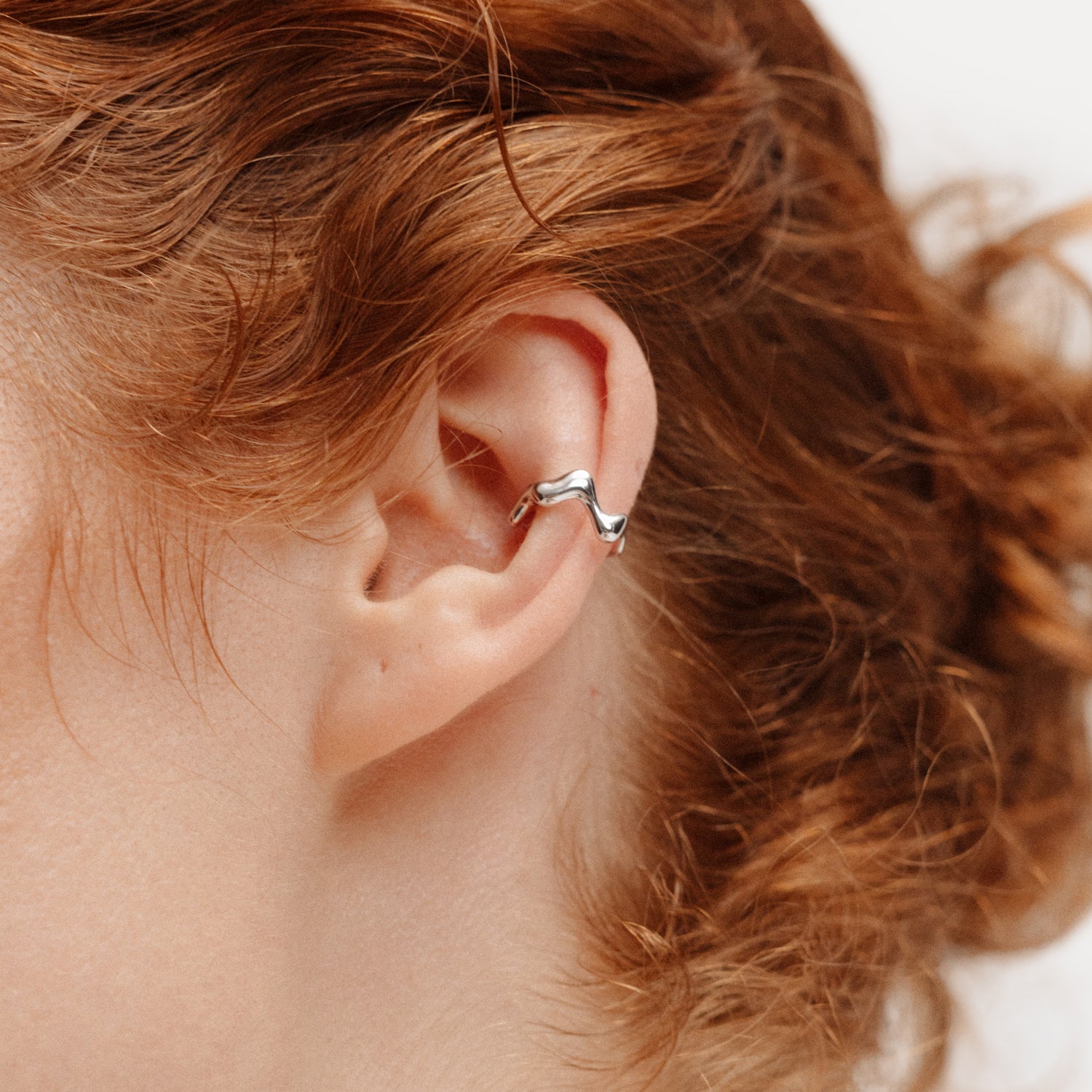 Poise Wave Ear Cuff, recycled Sterling Silver, shown on ear - VEYIA Berlin