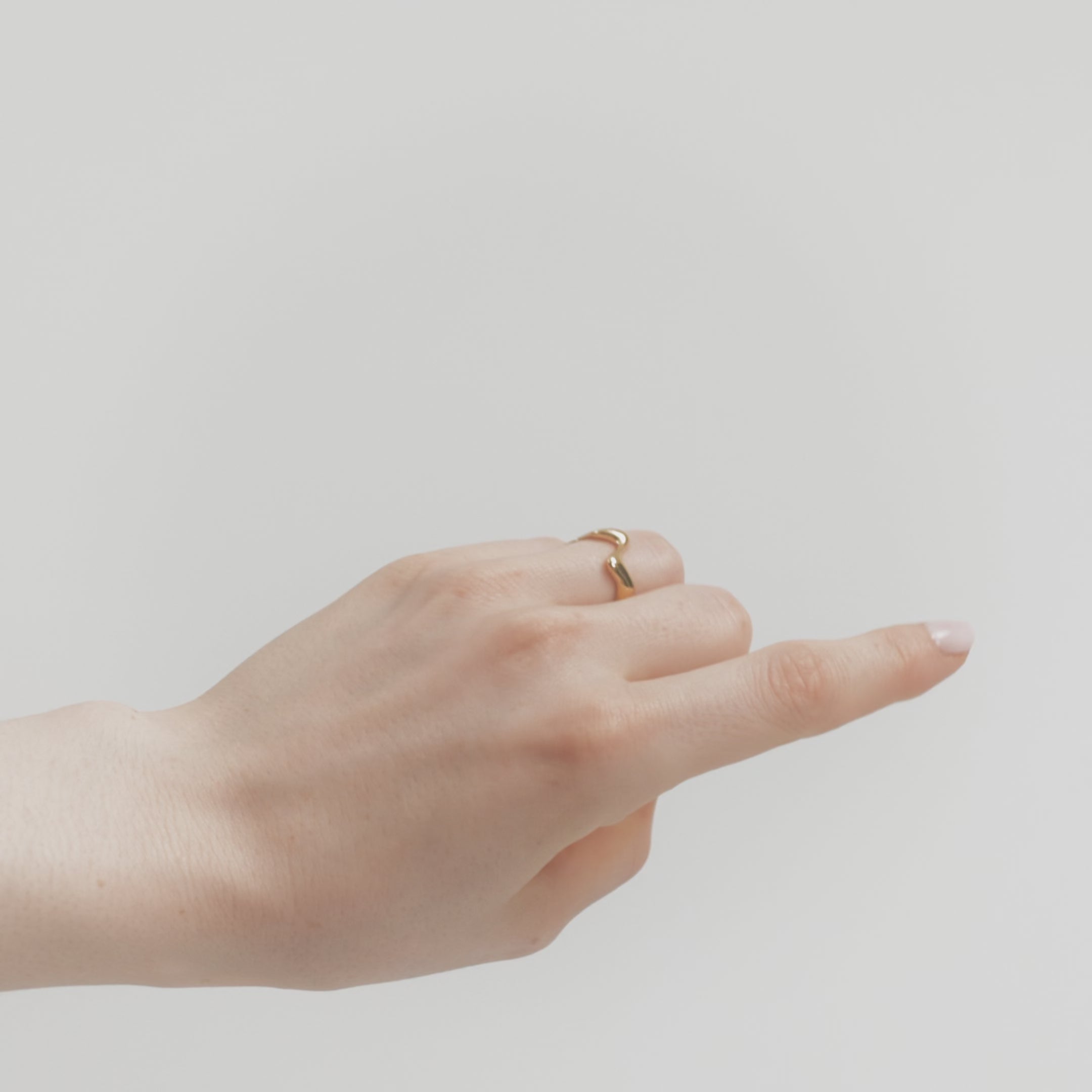 Poise Wave Ring, recycled 18k Gold Vermeil, shown on hand - VEYIA Berlin