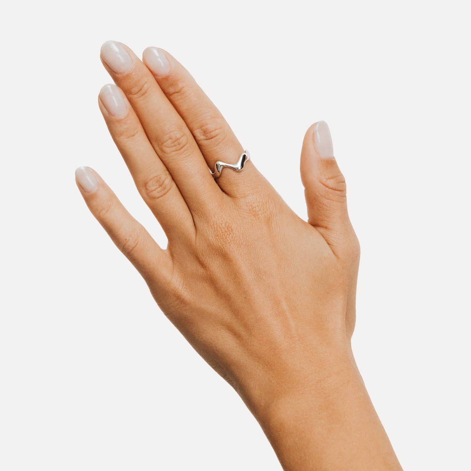 Poise Wave Ring, recycled Sterling Silver, shown on hand - VEYIA Berlin